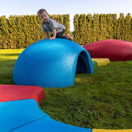 toddler-plays-on-a-red-play-tunnel